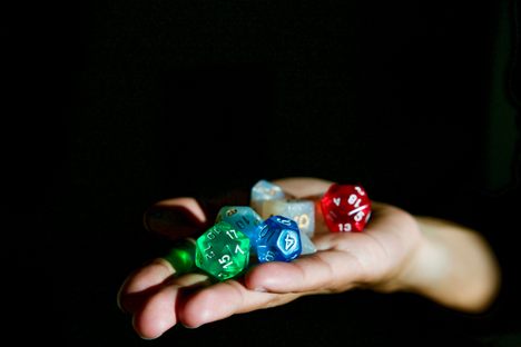 Someone about to roll some dice. 