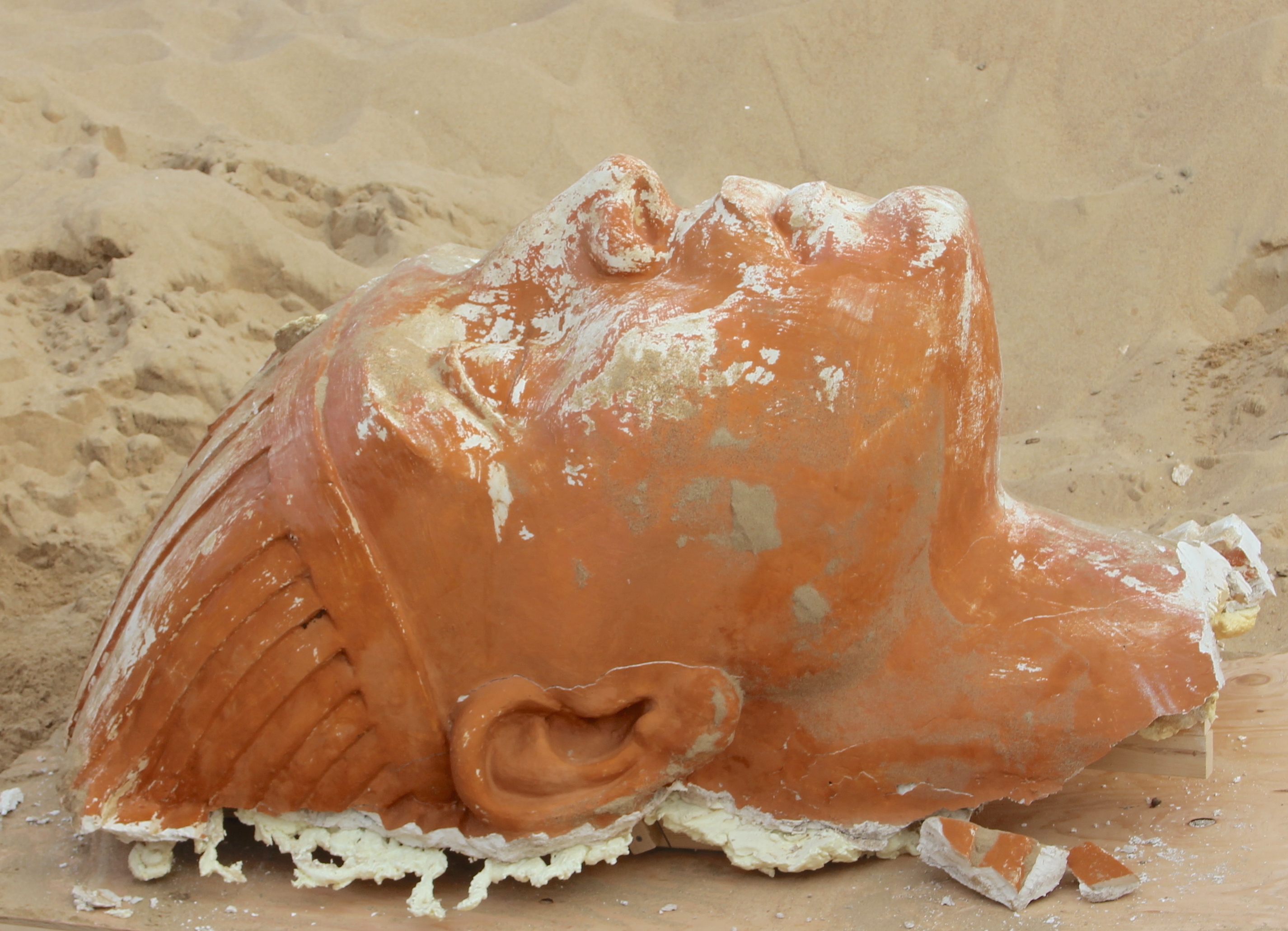 The head of the plaster sphinx, following days of excavation. 