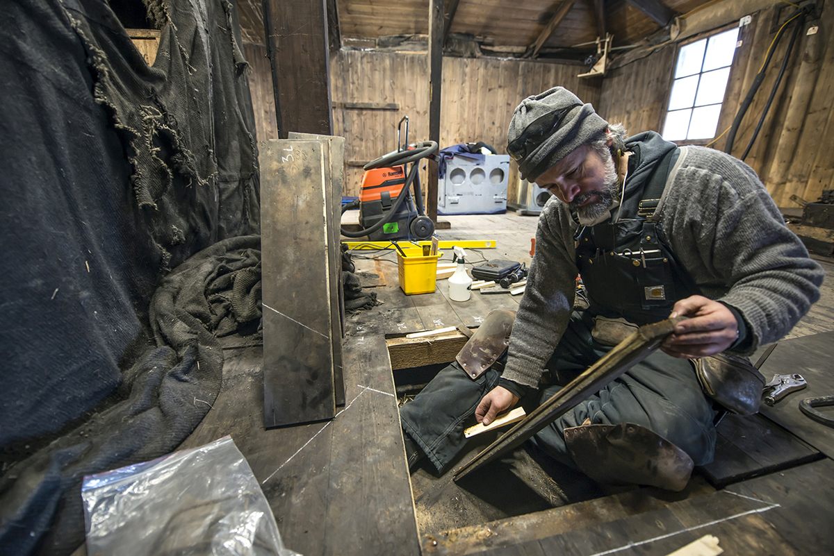 Gord Macdonald, the Lead Heritage Carpenter for Antarctic Heritage Trust, during conservation repair of the floor and subfloor at Discovery Hut.