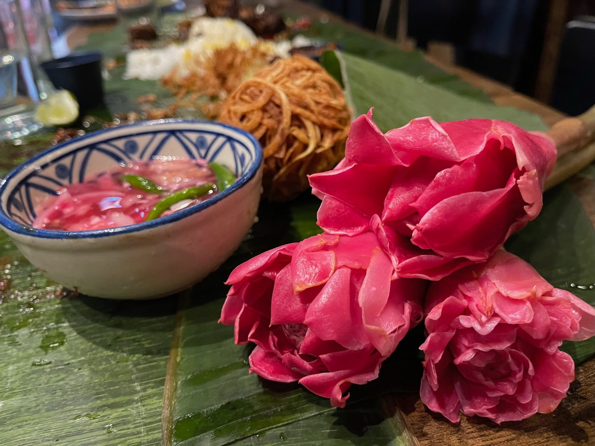 Vibrant torch ginger flowers are a quintessential Peranakan ingredient.