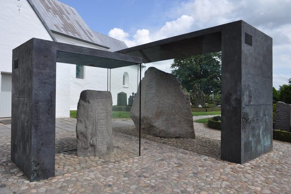 The Jelling stones, encased behind glass.