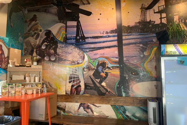 A surf mural in the interior of Dogtown Coffee.