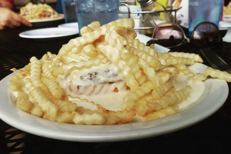 Potato wedge "nails" have been replaced by crinkle cut fries in many newer Horseshoes.