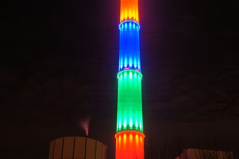 The chemnitz chimney illuminated at night.