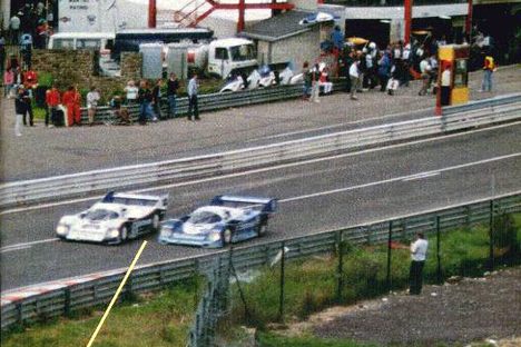 Jacky Ickx (white car) and Stefan Bellof (blue car), right before the crash in Spa
