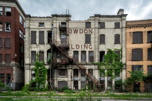 Vacant, crumbling buildings line the streets of Brownsville, Pennsylvania. A slump in the steel and coal industries hit the town hard, but property hoarding by two investors drove Brownsville to decay.