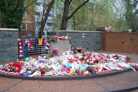 Tributes on the memorial next to the stadium.