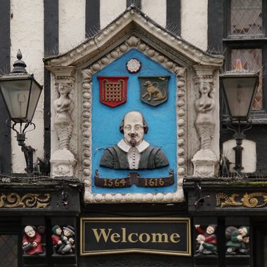 The Bard is represented on the sign. 