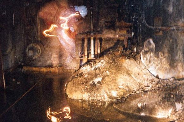 Artur Korneyev, Deputy Director of Shelter Object, viewing the "elephants foot" lava flow at Chernobyl, 1996.