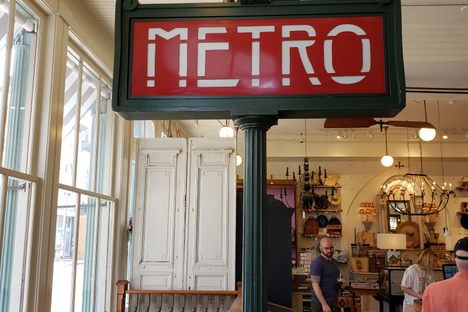Metro sign near the stairs to the basement