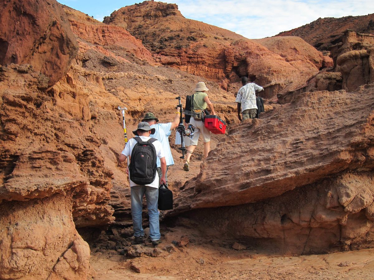 Researchers hike to Lothagam, one of many sites that tell the story of human evolution near Lake Turkana in Northern Kenya.