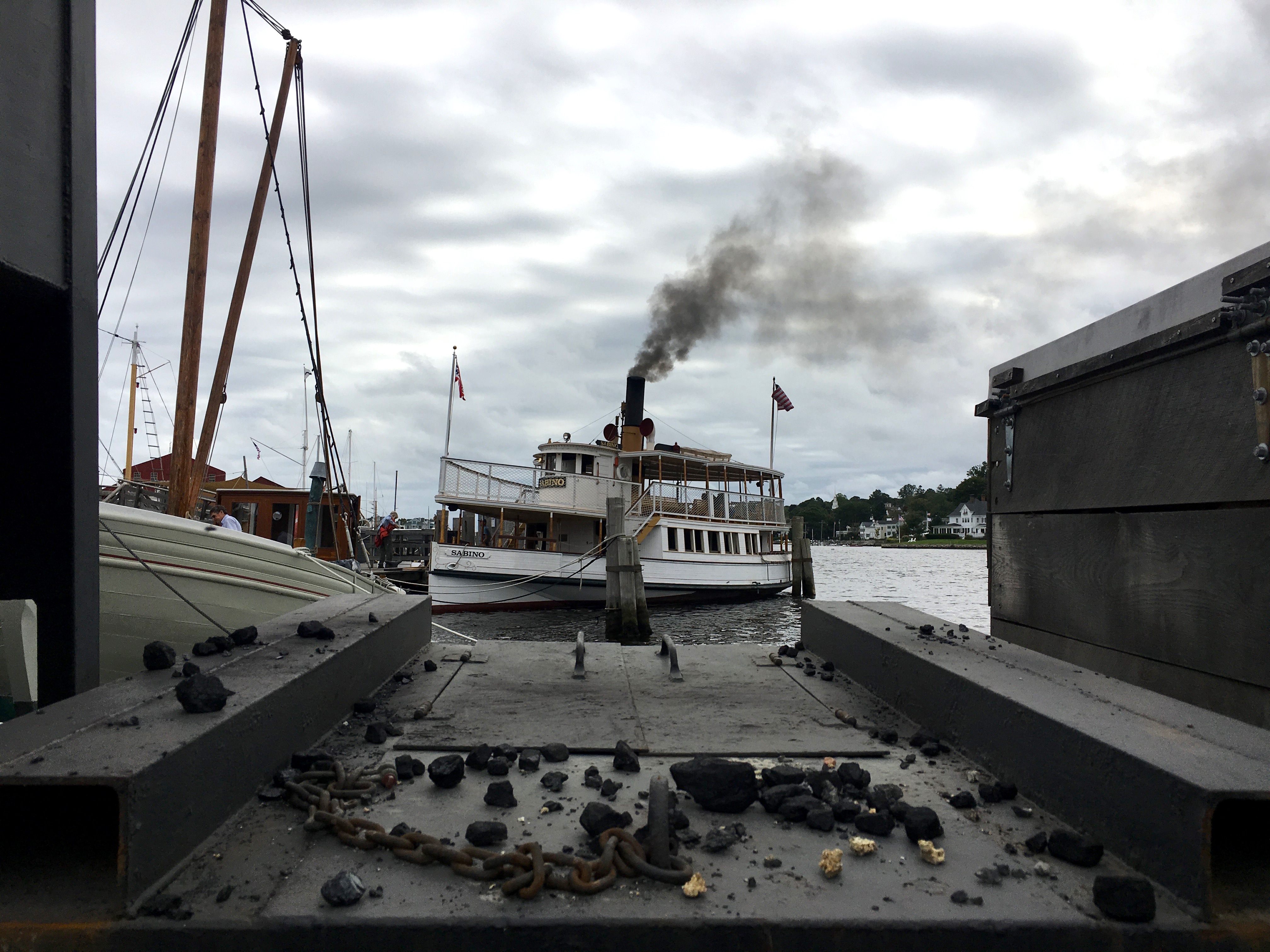 Coal chunks rest atop the storage box that holds Sabino’s fuel at the Mystic Seaport Museum.