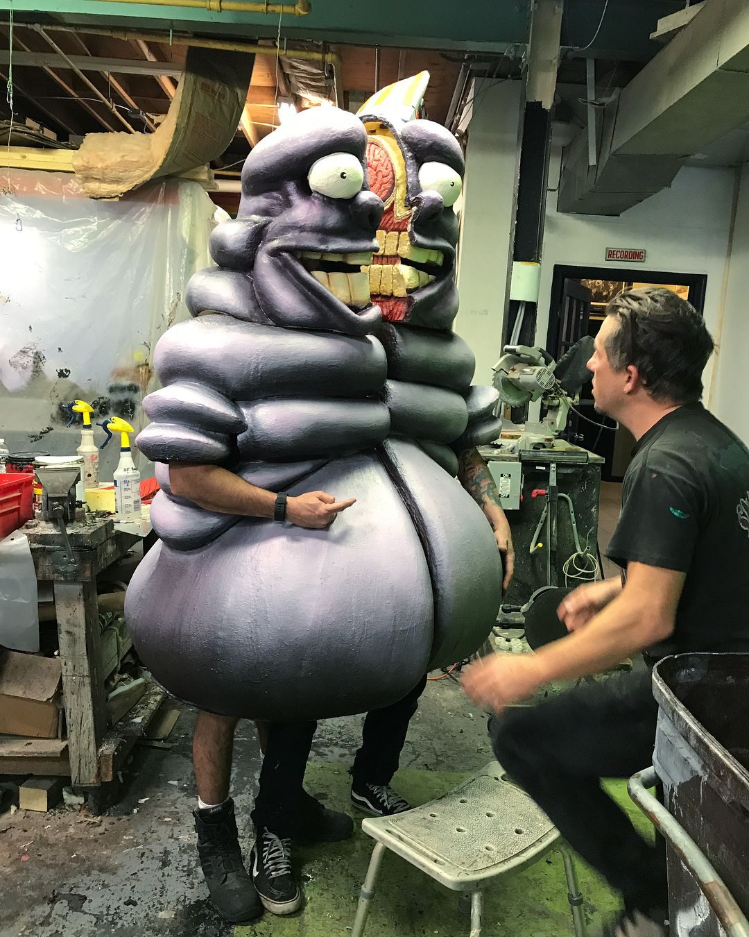 Technicians test the dynamic costume of the character Dickie Dunkin, performed by Matt Macguire and Scott Bryan, before putting on the finishing touches.