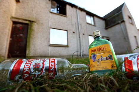 Empty bottles of Vodka and Buckfast, lay outside a disused house in Kirkcaldy, Scotland.