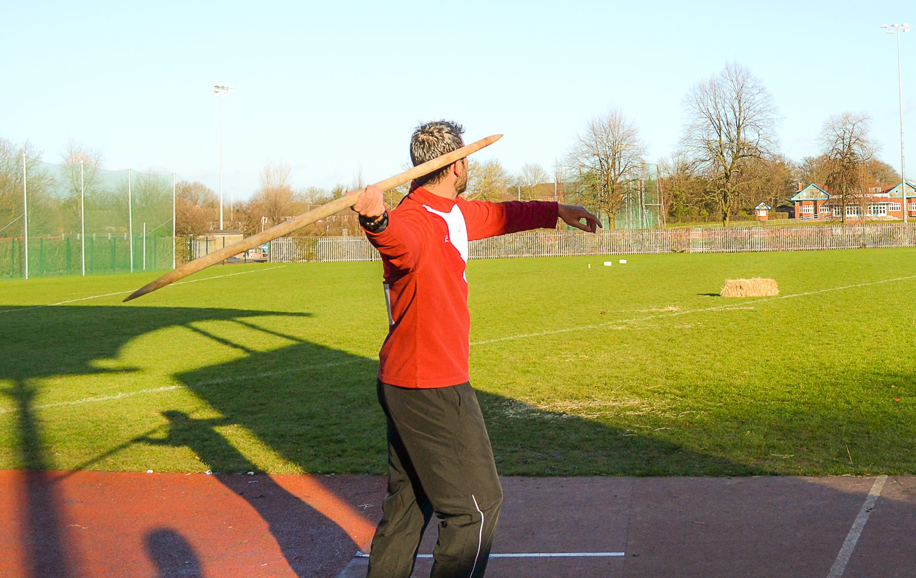 A javelin thrower with a replica spear.
