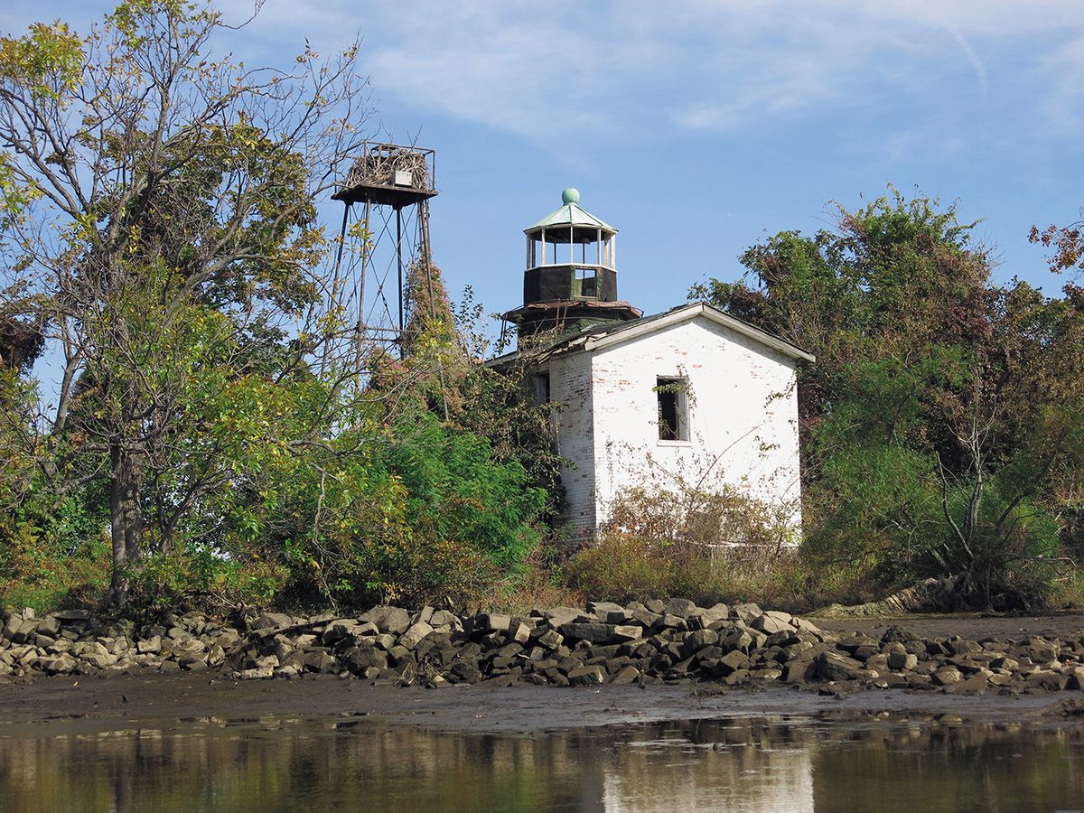 Fishing Battery Lighthouse in Maryland. The light was transferred to the tower in 1928; the original structure remains dilapidated.  
