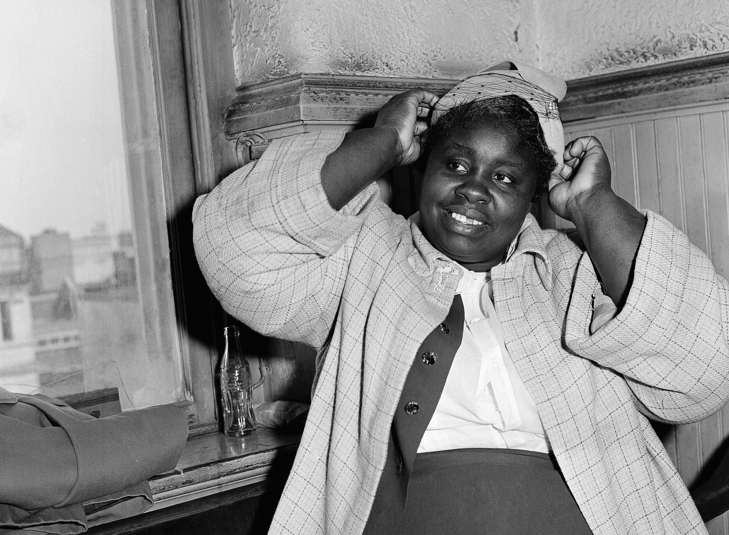 Georgia Gilmore poses for photographers after testifying as a defense witness in the bus boycott trial of Rev. Martin Luther King Jr., March 21, 1956, in Montgomery.