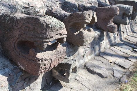 Some of the many stone snake head sculptures.