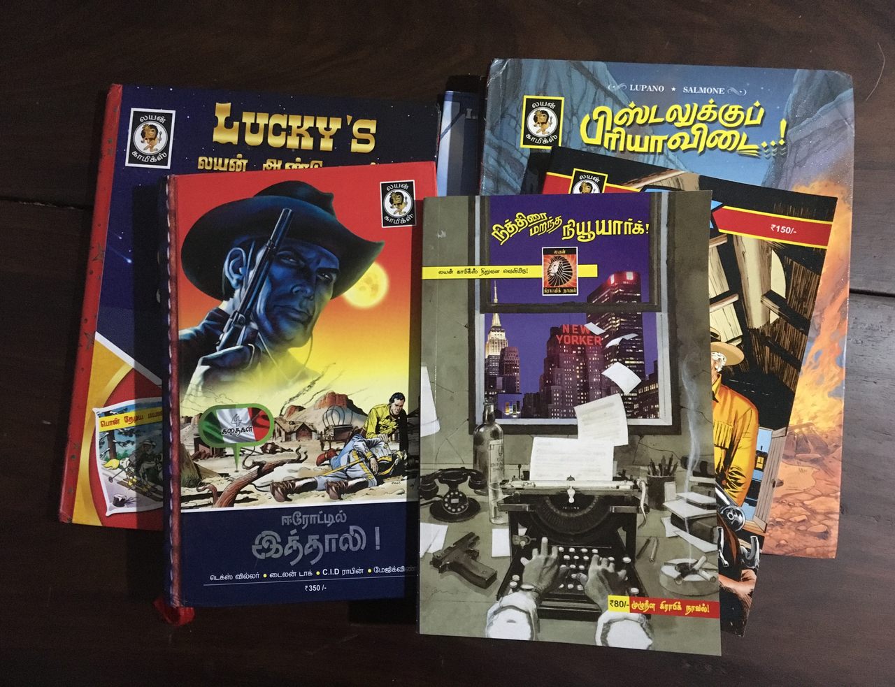 A selection of Tamil-language comics distributed by Lion-Muthu Comics.