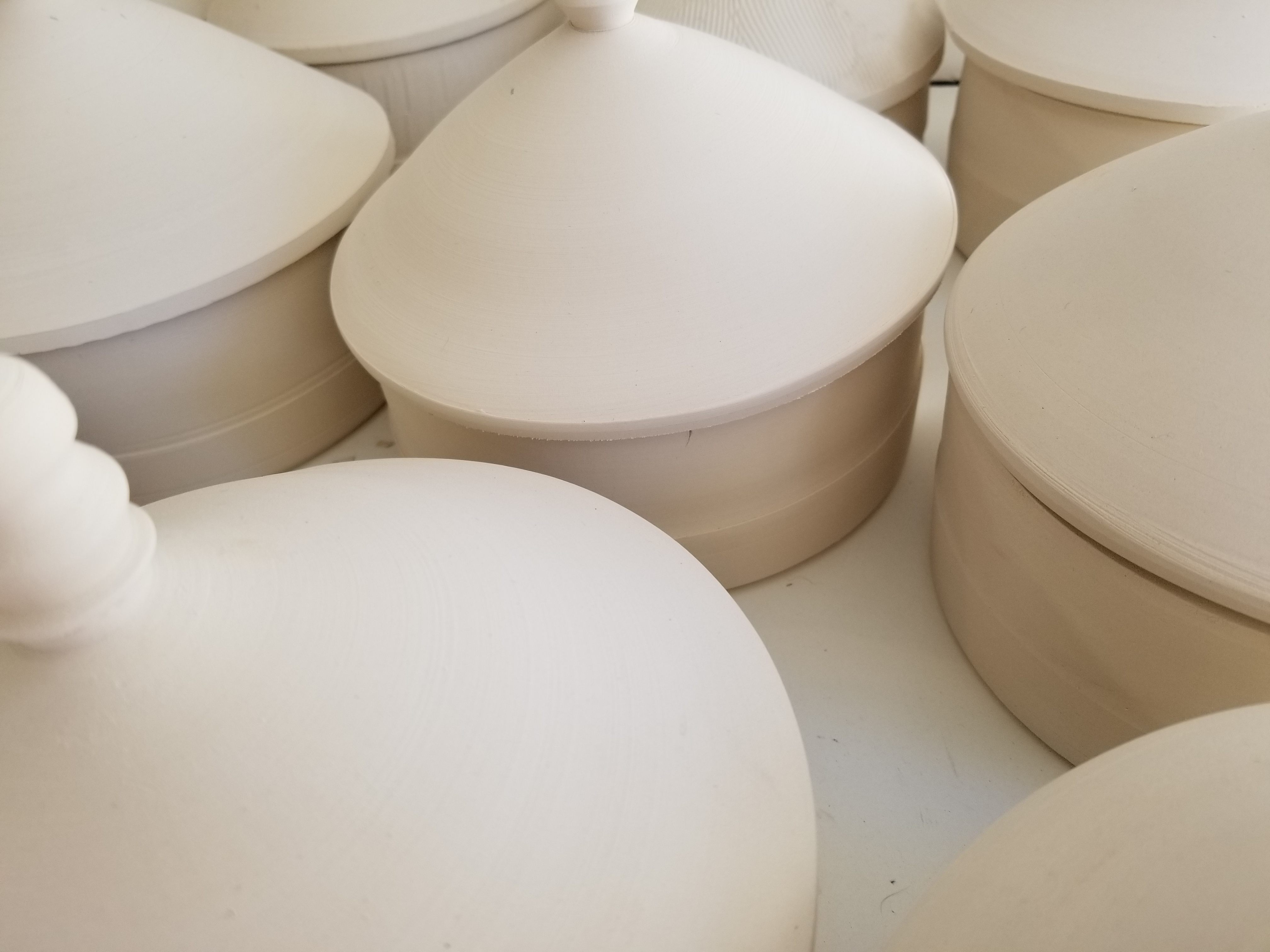 The barn-based pots that will receive the ash glaze. 