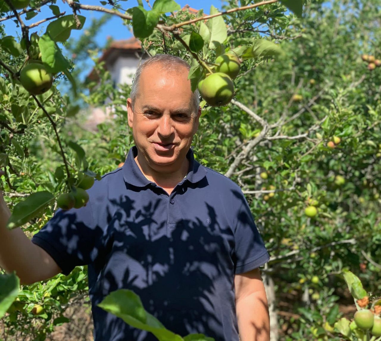 Father Rui Sousa in the parish orchards.