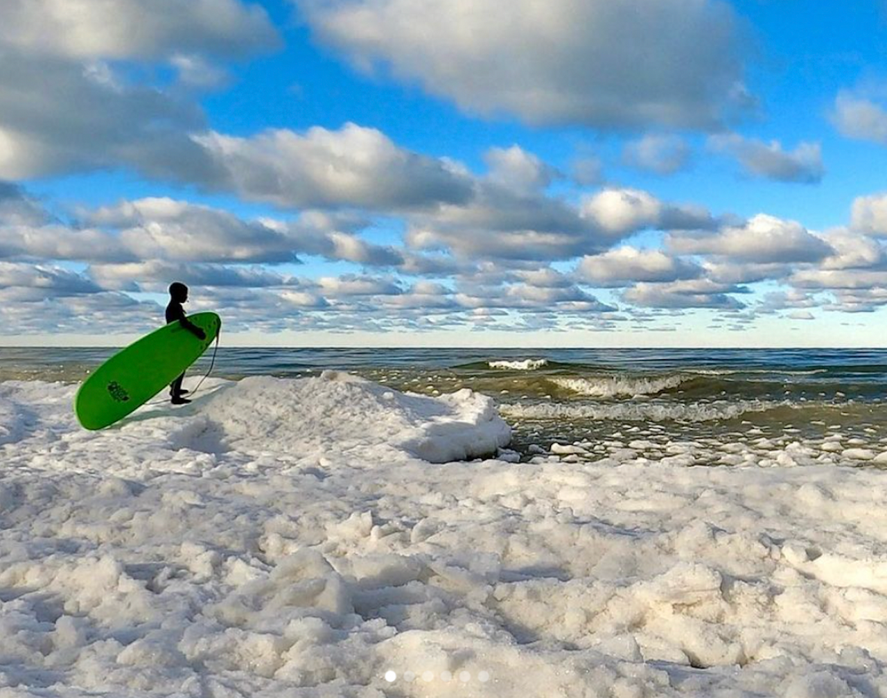 Jameson Walter, 11, contemplates a winter surf session on Lake Michigan, where he has been catching waves since the age of six.