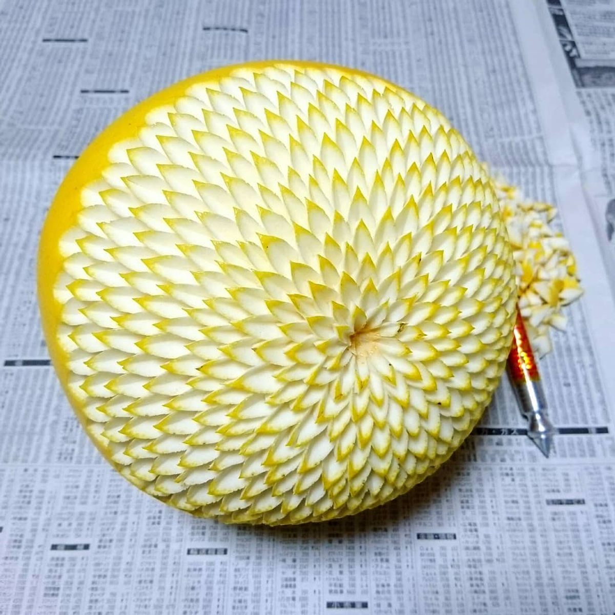 A white yuzu, carved as a flower.