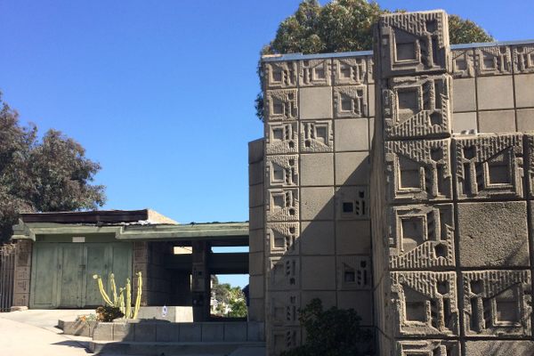 The house evokes a concrete quilt.