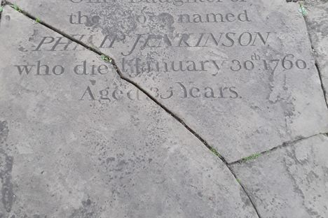 Late 18th century  headstone used as a paving stone outside the main door.