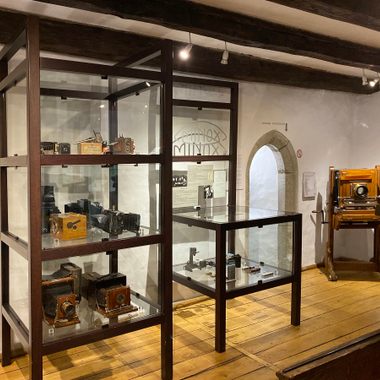 Vitrines with antique cameras.