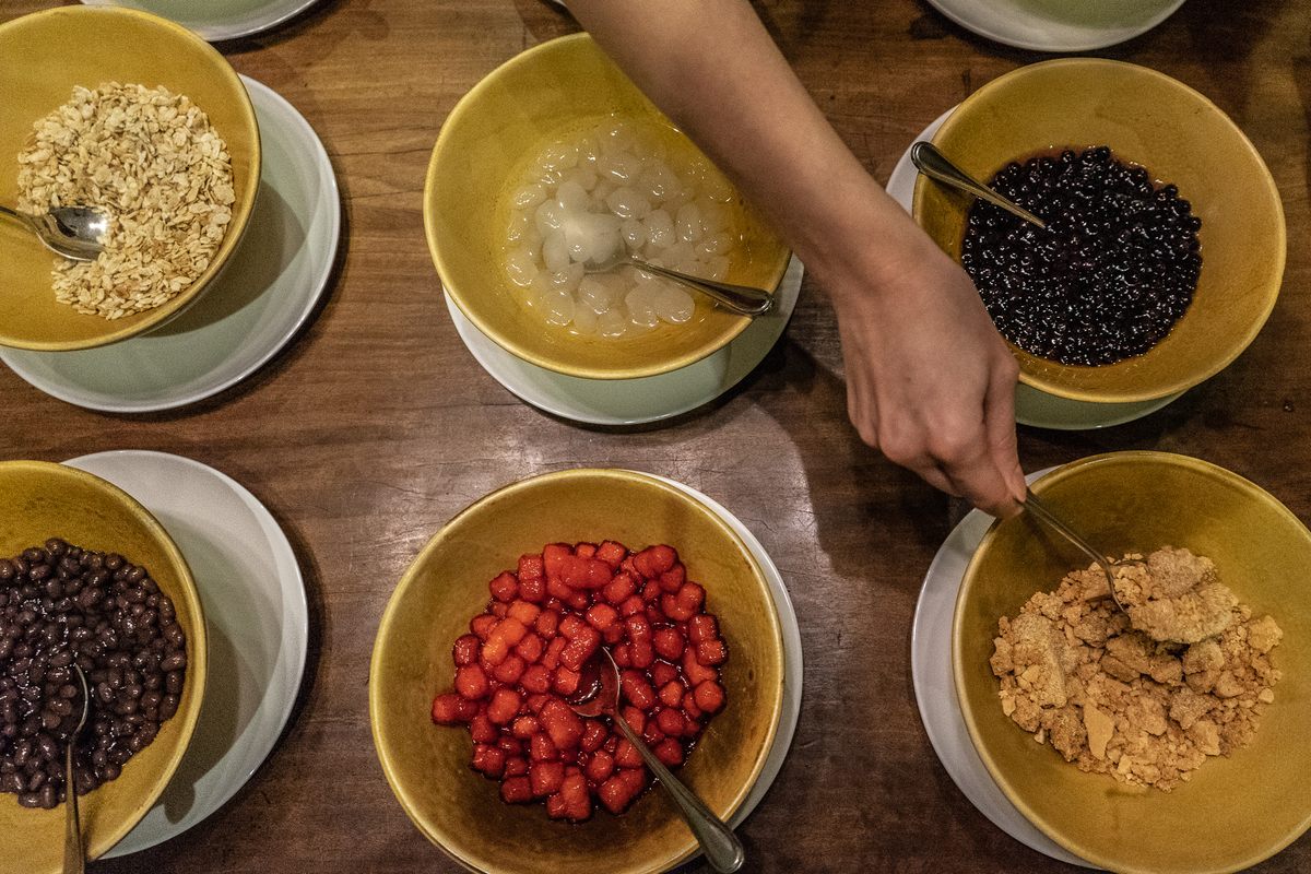 Mixing ingredients for halo-halo is a choose-your-own adventure.