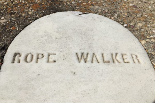 A detail of his original headstone.