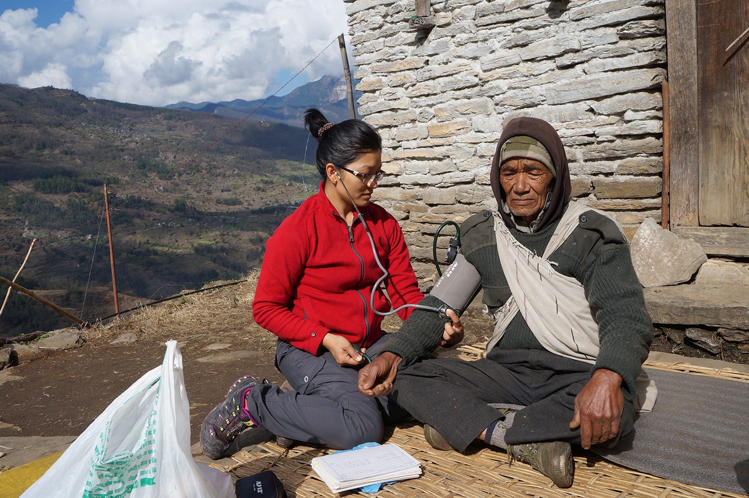 Dr. Sobi Maya Tamang with a patient in a remote village in the Himalayas. 