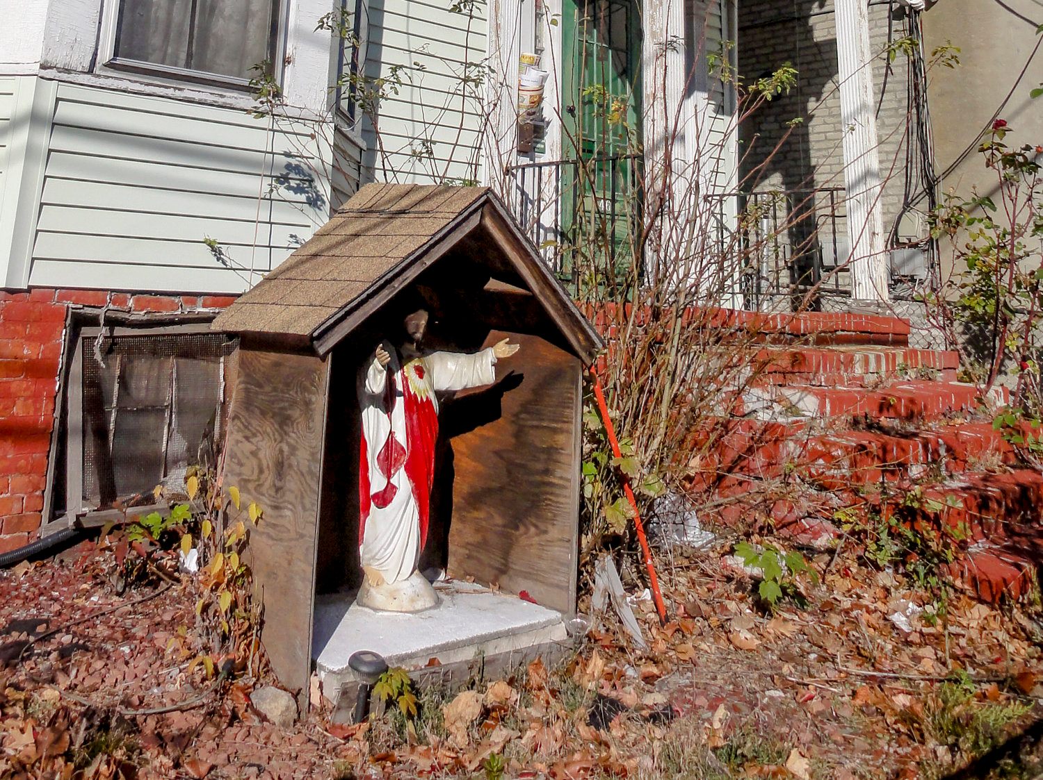 This Jesus has its own wooden house, complete with a shingled roof.