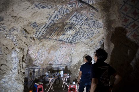Colombian conservator Clemencia Vernaza peers up at her work in Colombia's Parque Arqueológico Nacional de Tierradentro.
