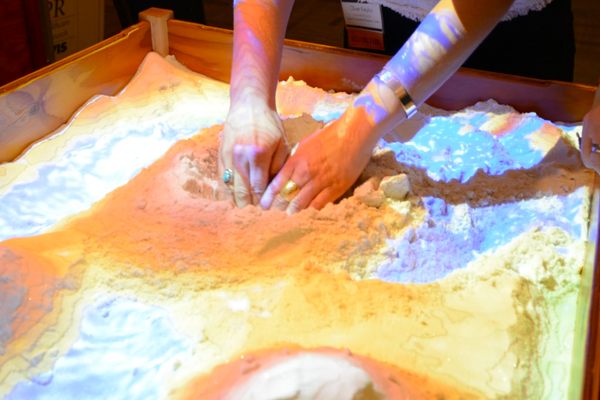 Users can make mountains, valleys, rivers and lakes using the Augmented Reality Sandbox. 
