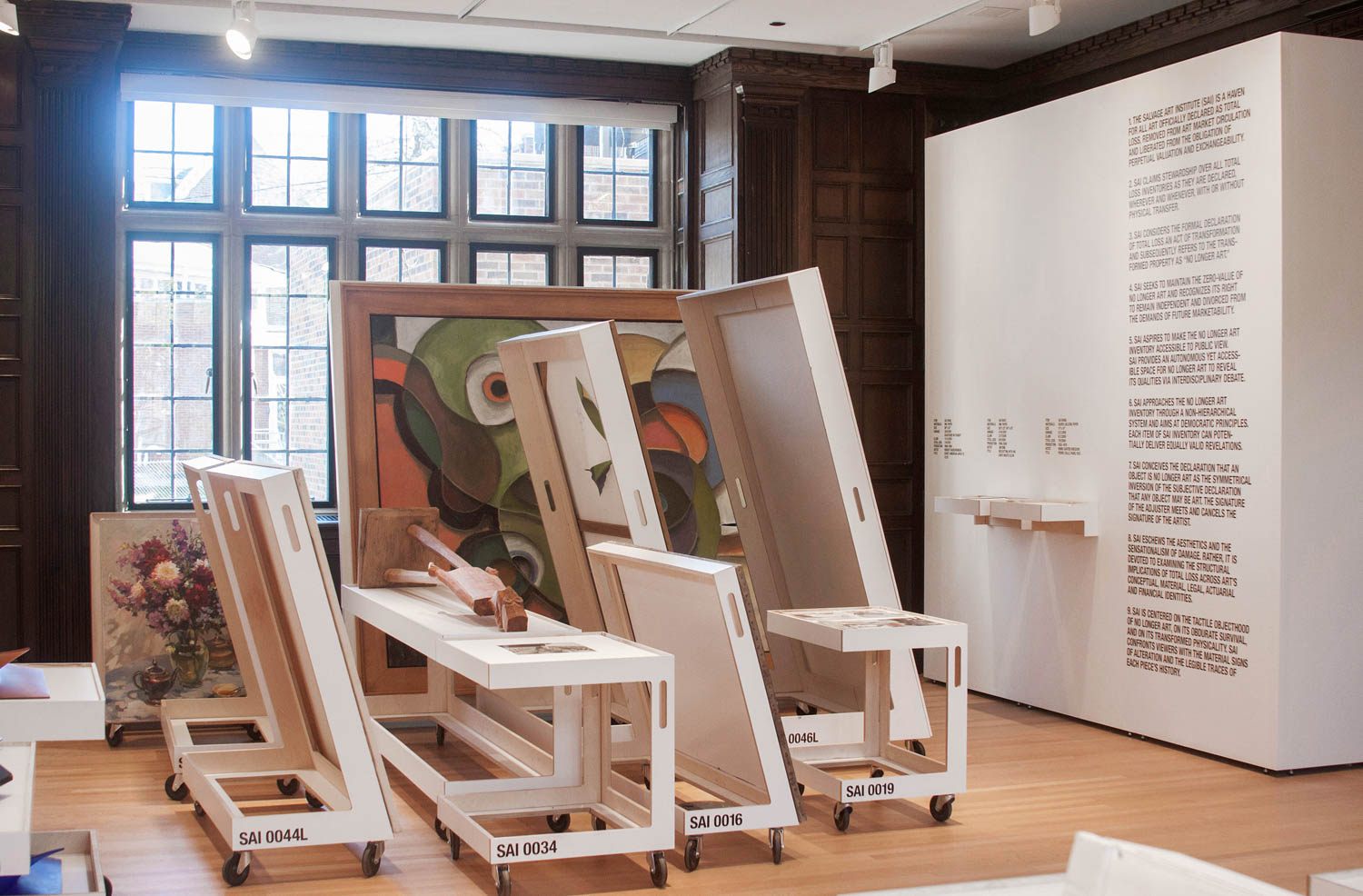 <em>No Longer Art: Salvage Art Institute</em> at the University of Chicago in 2015, with SAI's policies on the wall.