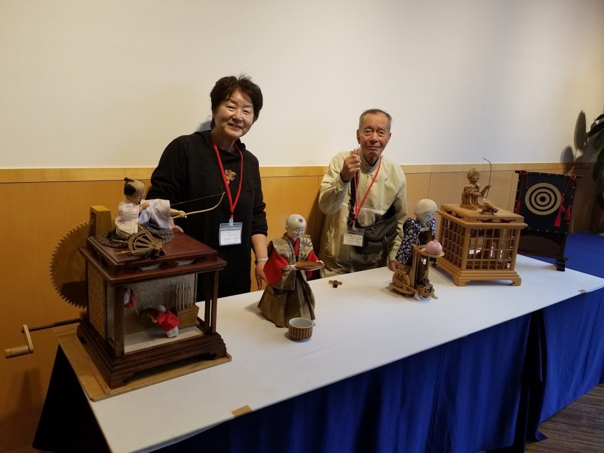 Kimiko Hirahata (left) and Shigeo Tanimoto with their wooden automatons—the culmination of years of work.