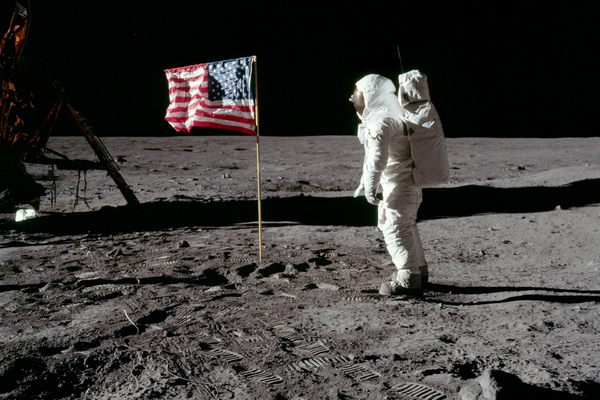 Buzz salutes the American Flag in 1969.