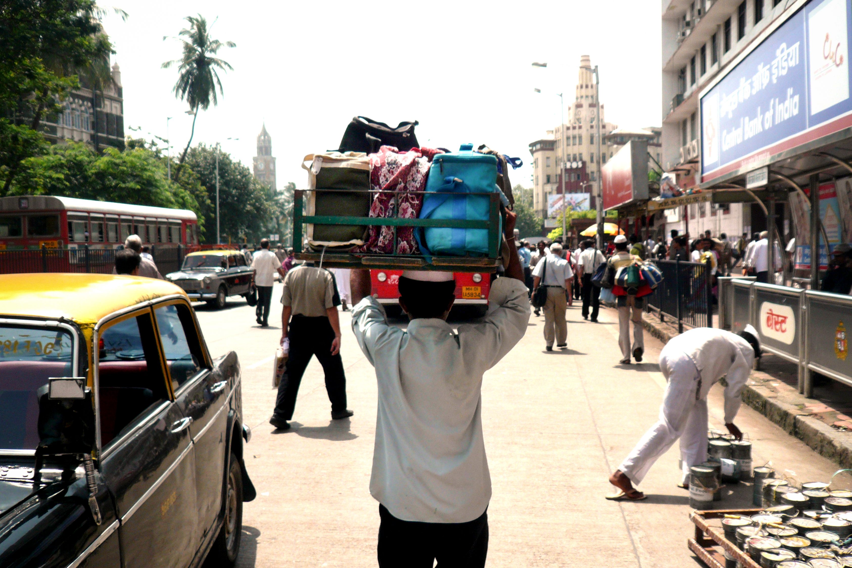 Dabbawalas at Churchgate Station, getting ready to deliver.