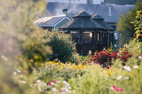 At The Well, guests can dine in large, wooden gazebos or sit by the fire pit for snacks and drinks.