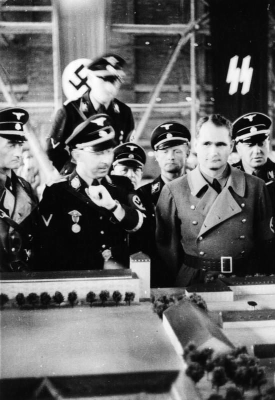 Himmler and Rudolf Hess at Dachau in 1936, viewing a scale model of the camp