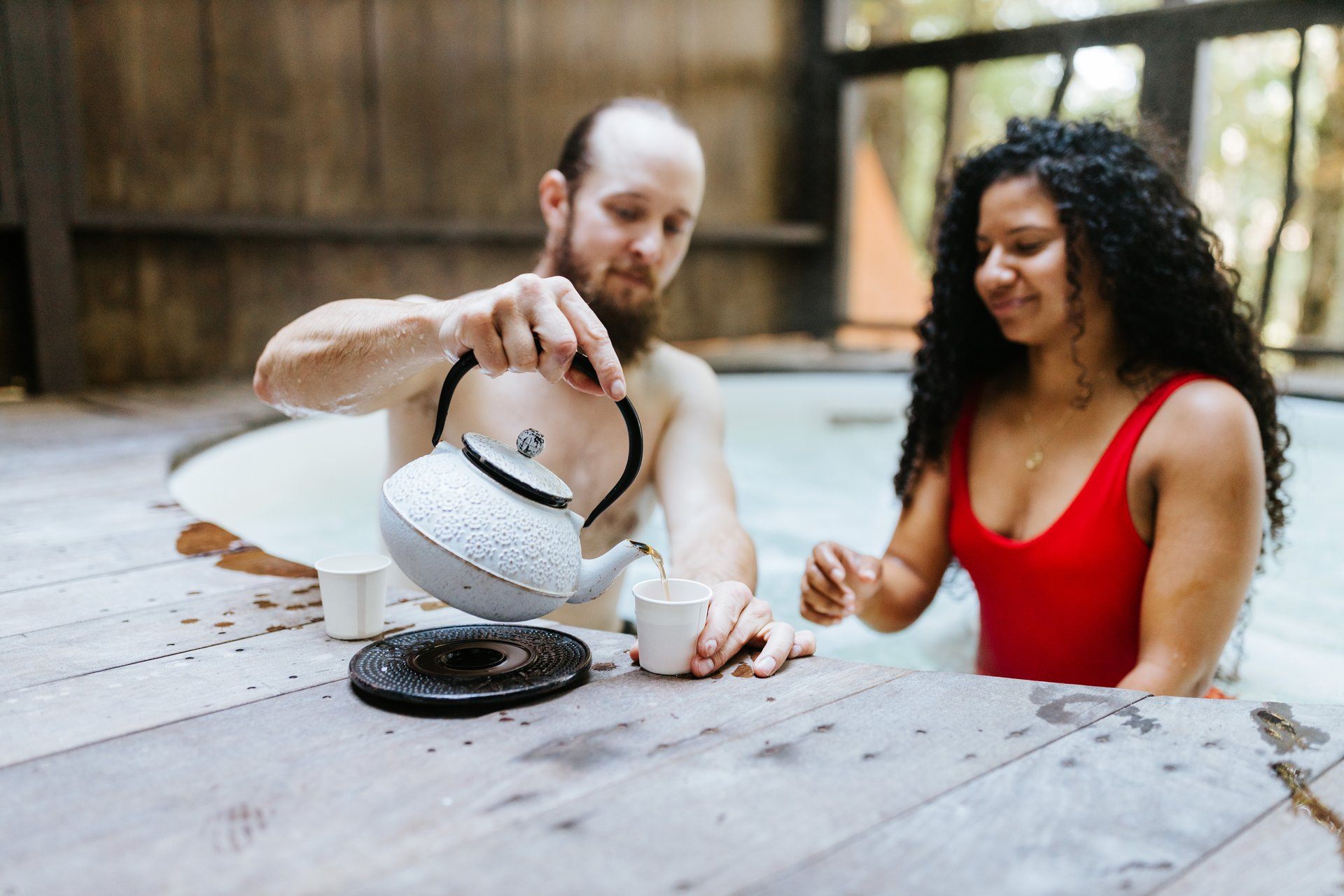 A couple sharing tea at Asheville’s Shoji Spa & Retreat, within the Blue Ridge Mountains.