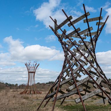 Two of Lough Boora Discovery Park’s tallest sculptures memorialize peat’s role as fuel.