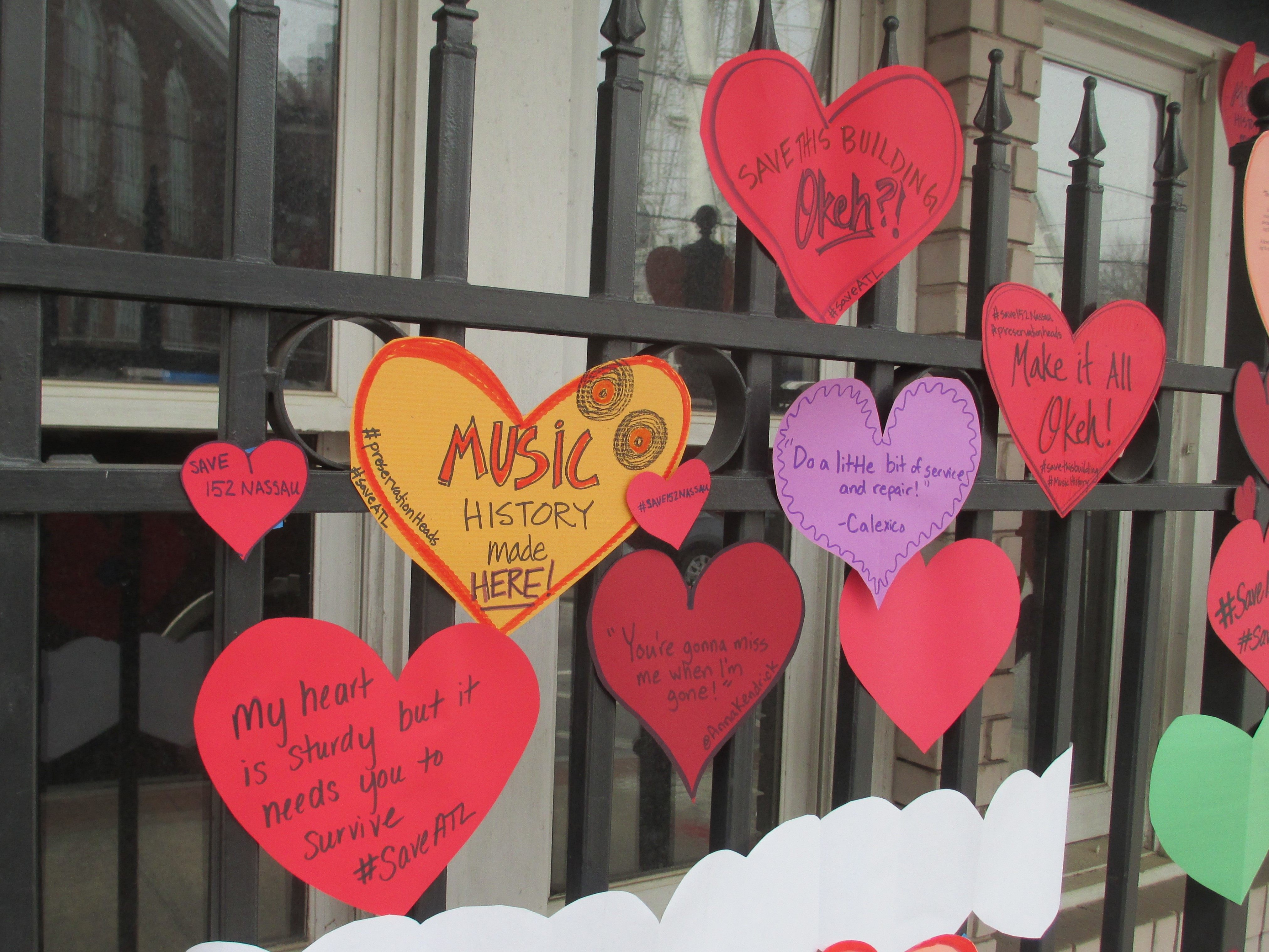 Supporters of the campaign to save 152 Nassau have been posting little paper hearts on the front of the building.