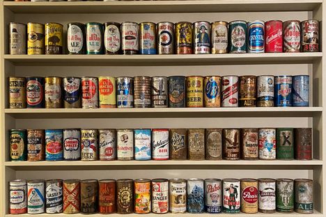 Hundreds of beer cans are displayed in Maxwell’s home, organized first by country and style, then arranged alphabetically by brand and age.