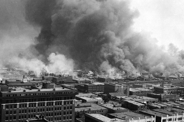 Smoke billows over Tulsa, Oklahoma, during the 1921 Tulsa Race Massacre.