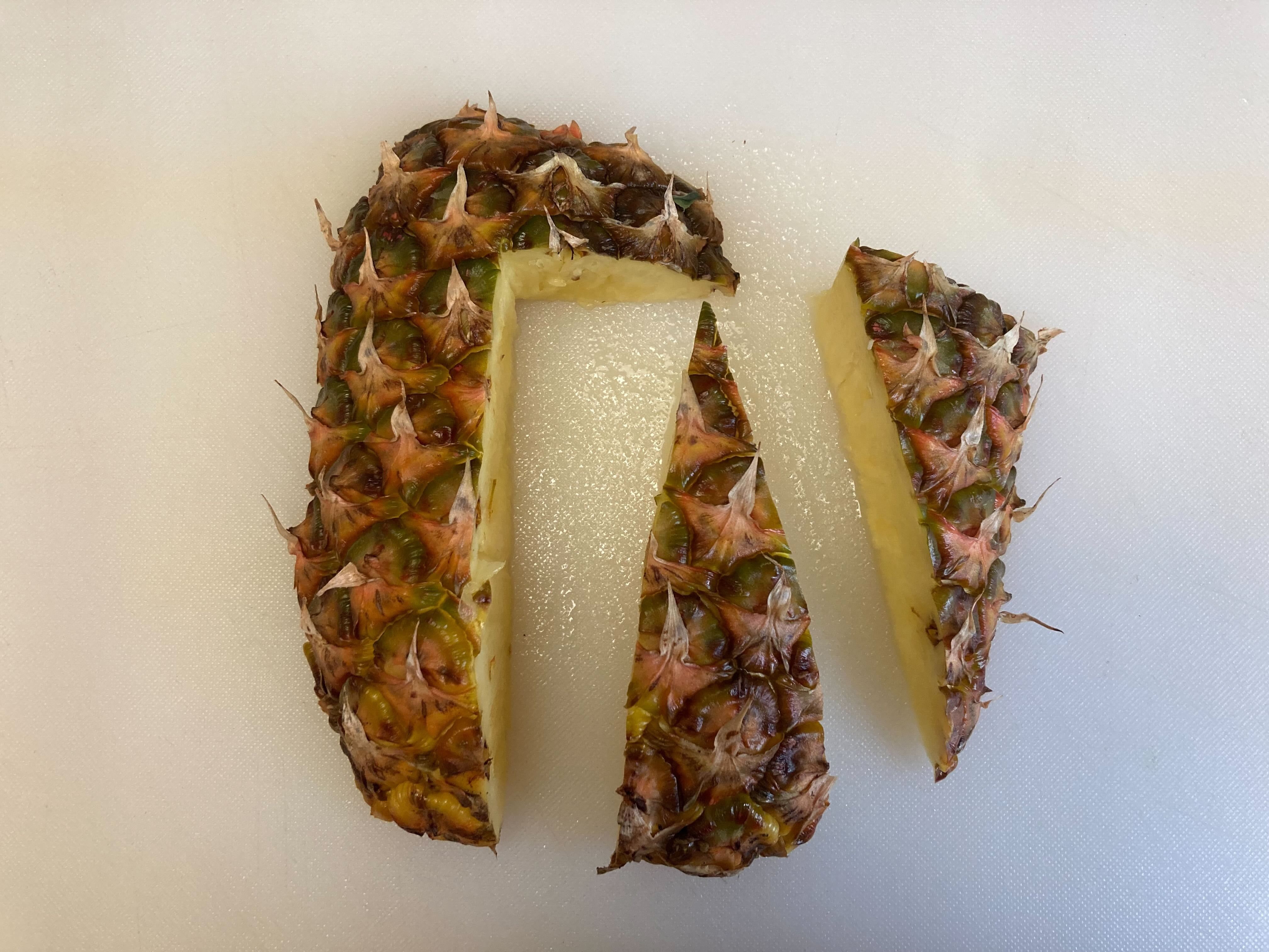 Cut the pineapple slice like this for your bird's wings and head.