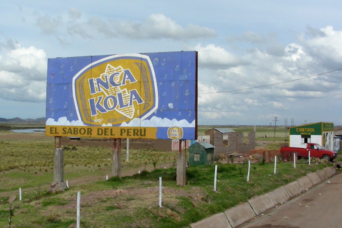 This billboard describes Inca Kola as "the taste of Peru."