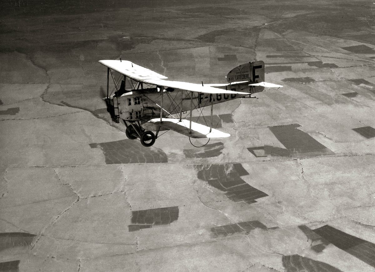 Aéropostale often reused World War I biplanes, like this French Breguet XIV, to transport mail across West Africa.  This photo was taken between 1927 and 1928, about 260 miles northeast of Tarfaya.